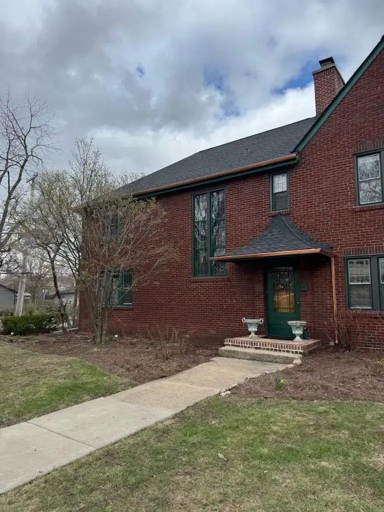 Custom half round copper gutters and twisted downspouts — photo 3