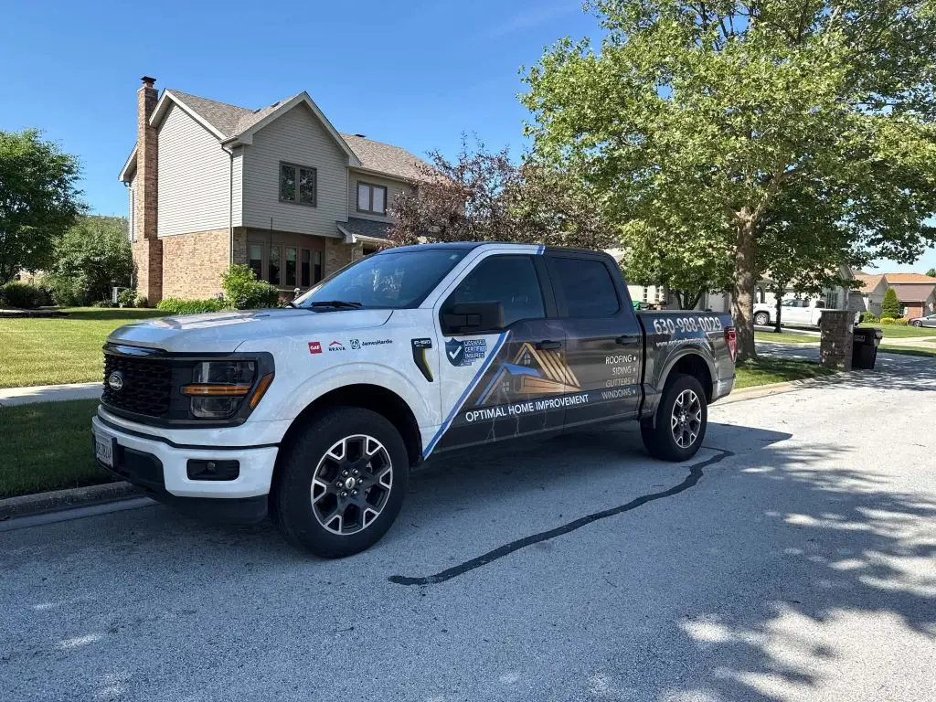 Optimal Home Improvement branded truck at a job site