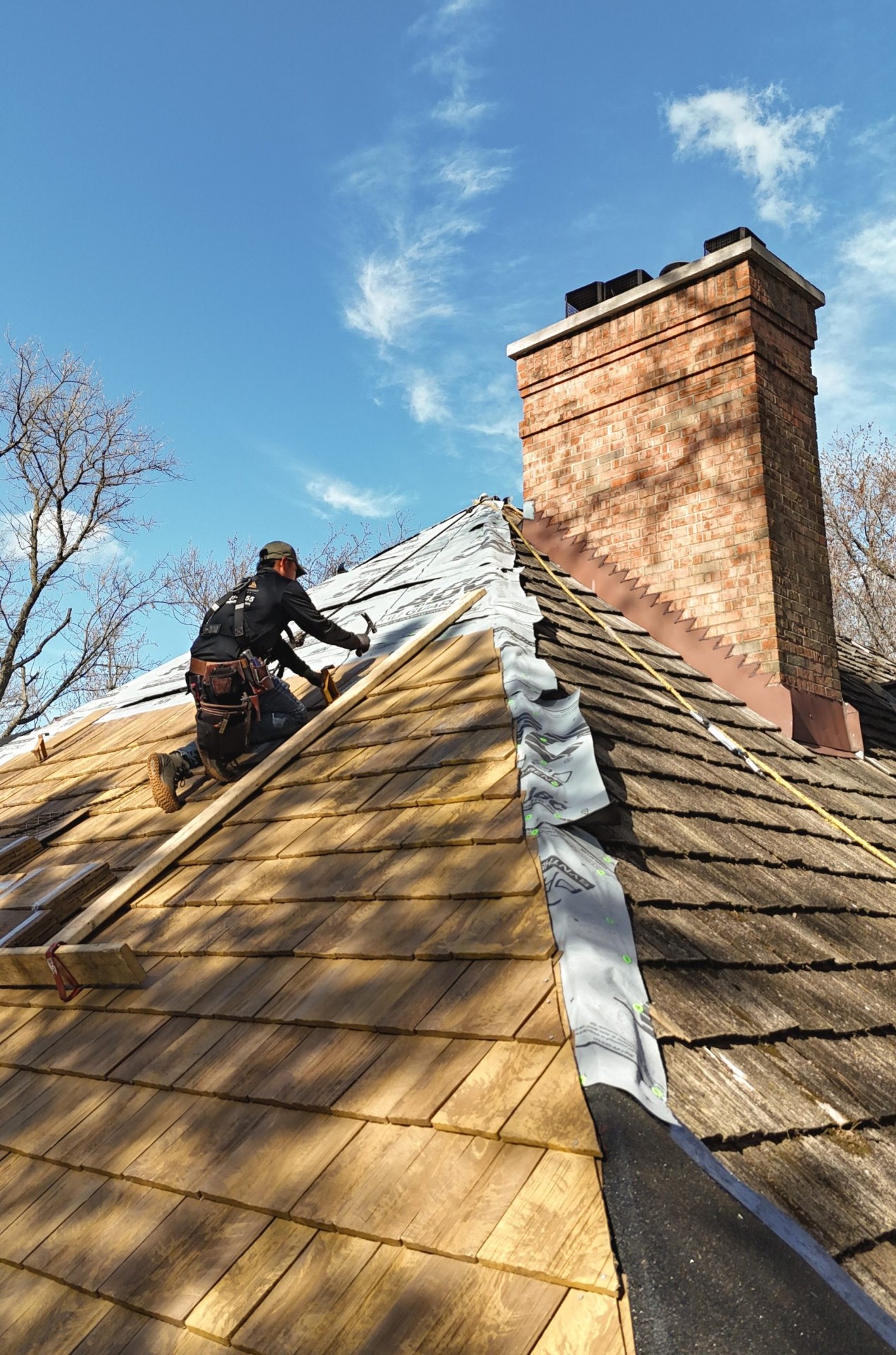 Optimal installer working on cedar-look roof